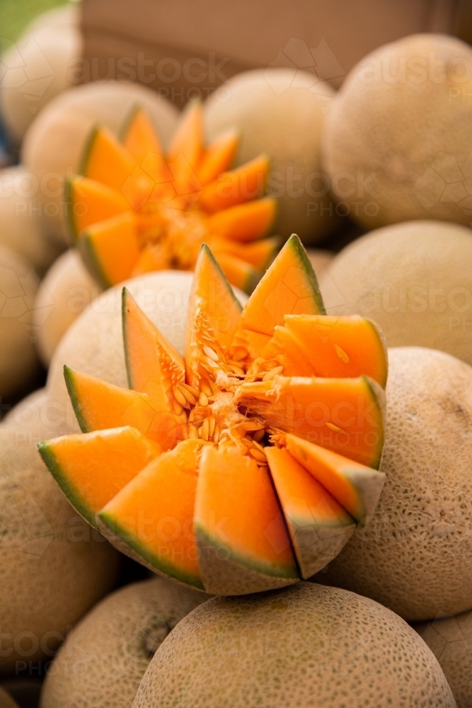 cut open fresh rockmelon at the markets - Australian Stock Image