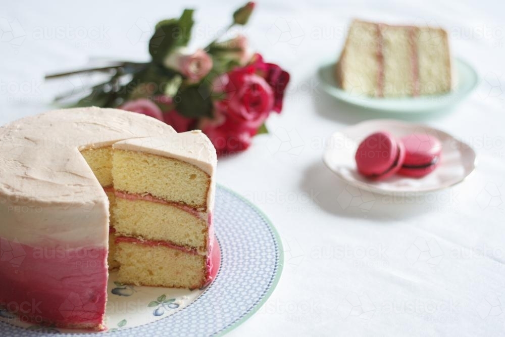 Cut pink ombre cake - Australian Stock Image