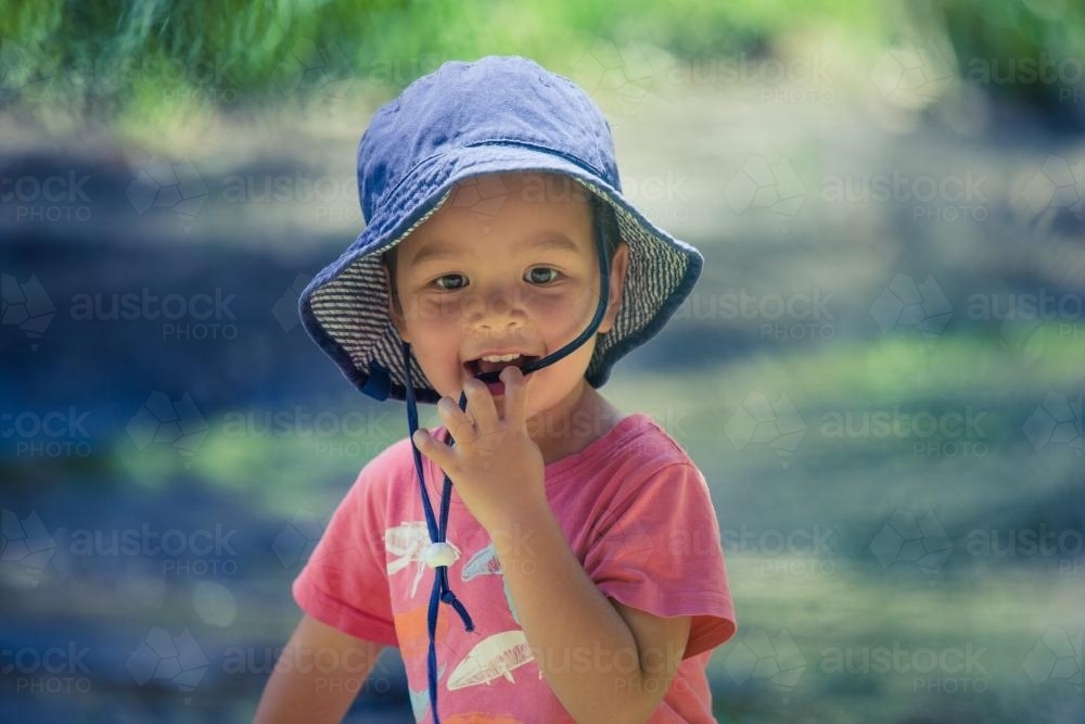 Cute mixed race little boy bushwalking on the Warrumbungles National Park Nature Trail - Australian Stock Image