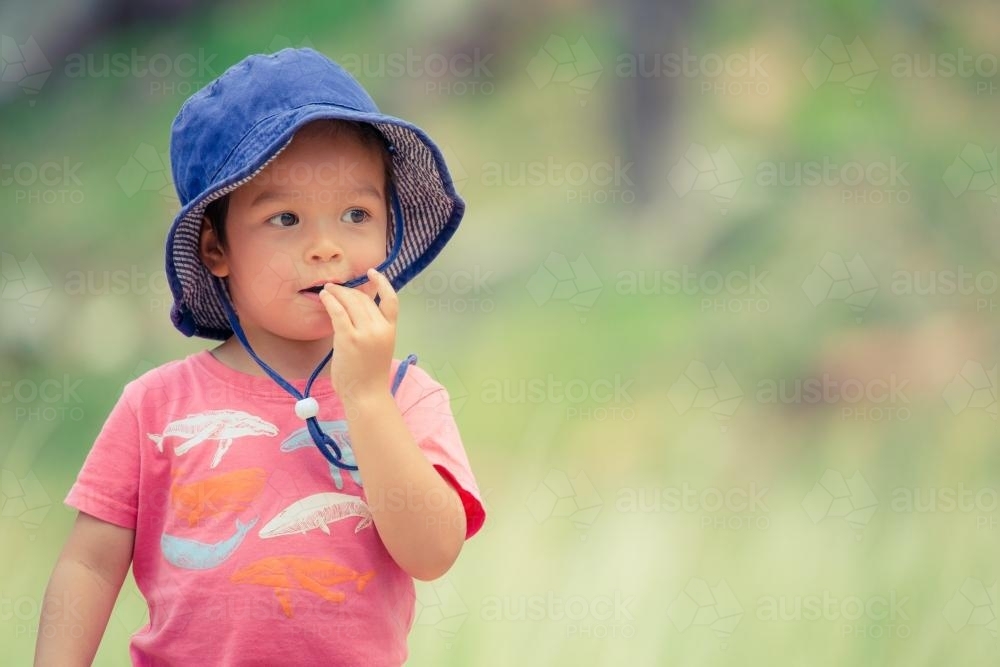 Cute mixed race little boy bushwalking on the Warrumbungles National Park Nature Trail - Australian Stock Image