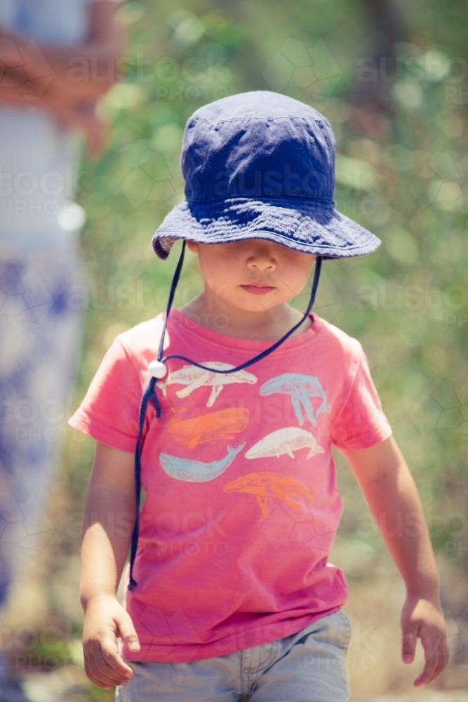 Cute mixed race little boy bushwalking on the Warrumbungles National Park Nature Trail - Australian Stock Image