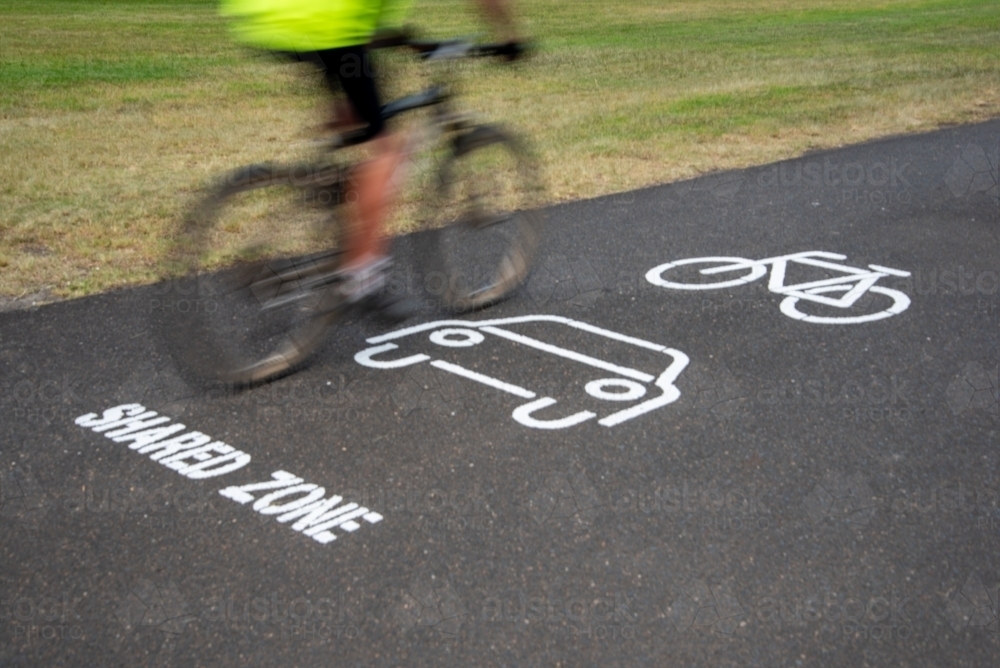 Cycle Racks Shared Use Path Image of Cycle path shared zone with cyclist - Austockphoto