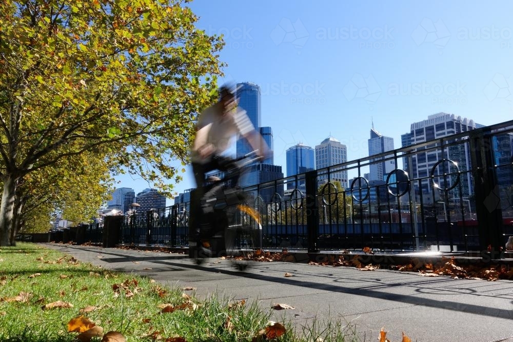 Cyclist on Banks of Yarra River, Melbourne - Australian Stock Image