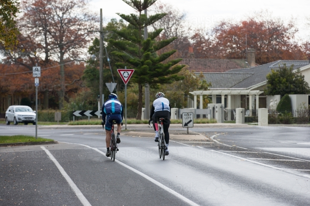 cyclists approaching a roundabout in a city - Australian Stock Image
