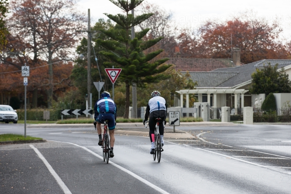 cyclists approaching a roundabout in the city - Australian Stock Image