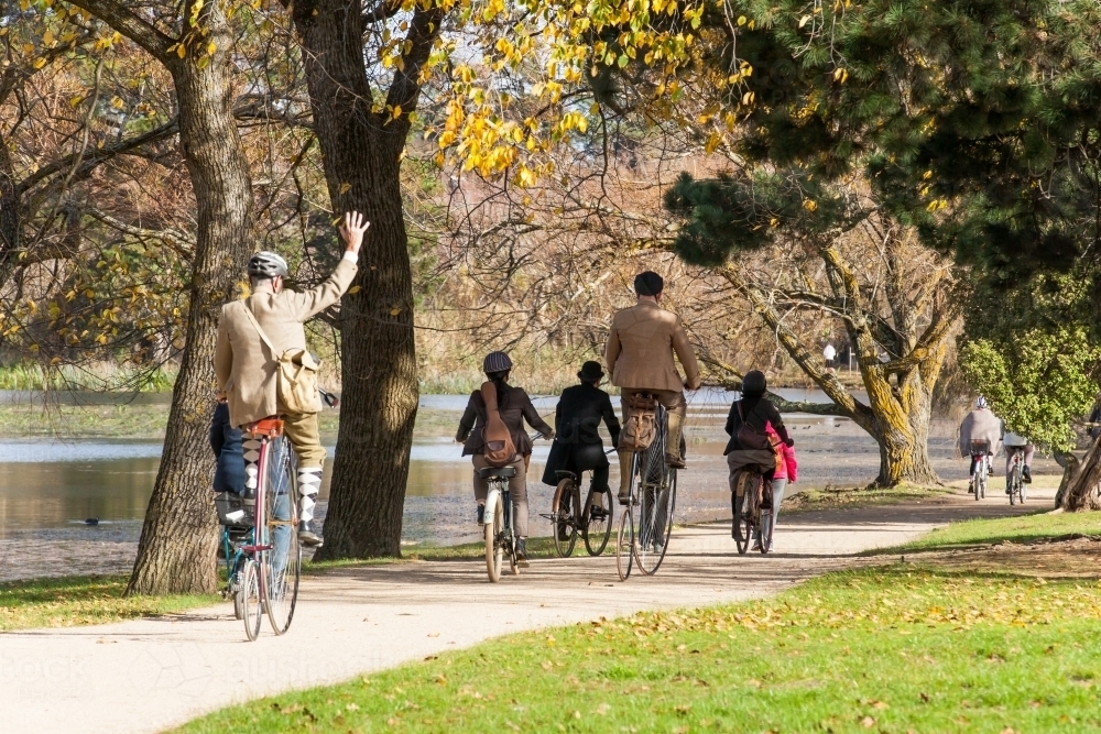 Cyclists participating in a Tweed ride on heritage bikes - Australian Stock Image
