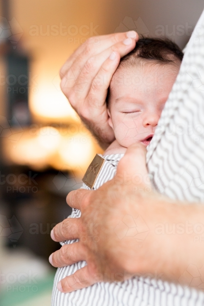 Dad holding baby - Australian Stock Image