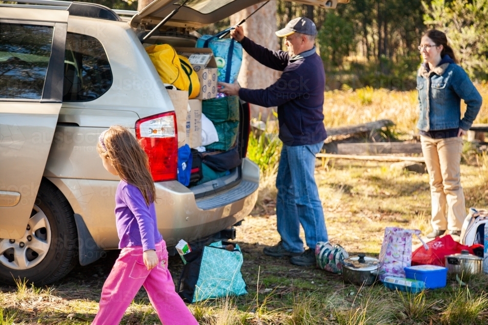 Dad packing family car for holiday trip - Australian Stock Image