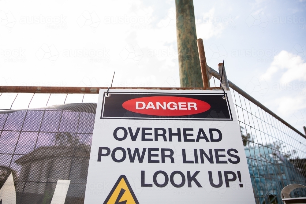 danger overhead power lines sign - Australian Stock Image