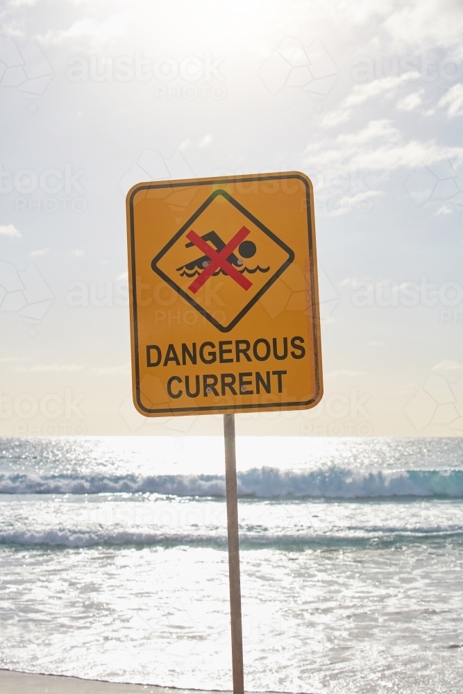 Image of Dangerous current sign at beach - Austockphoto