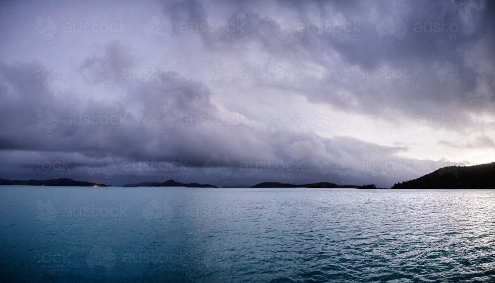 dark storm clouds over water - Australian Stock Image
