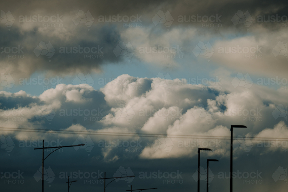 Dark, thick layered clouds over urban sky - Australian Stock Image