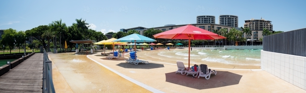 Darwin Waterfront, Wave Pool with umbrellas - Australian Stock Image