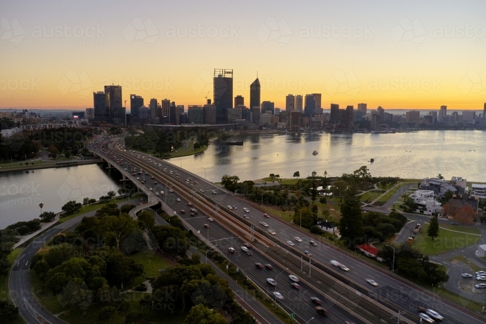 Dawn aerial view of the Perth City skyline and Narrows Bridge on a hazy morning. - Australian Stock Image