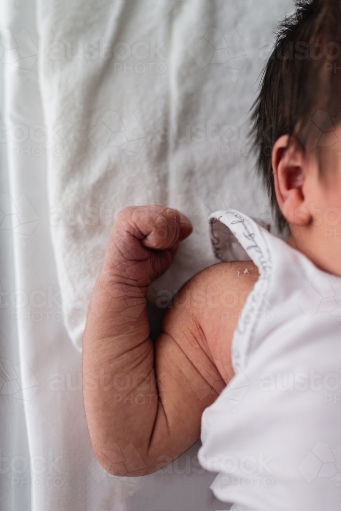 Day old newborn baby in hospital cot - Australian Stock Image
