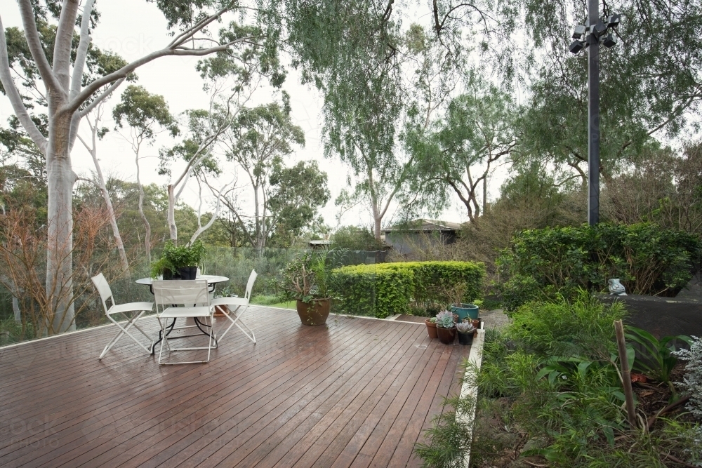 Deck patio amongst native Australian landscaping and gum trees - Australian Stock Image