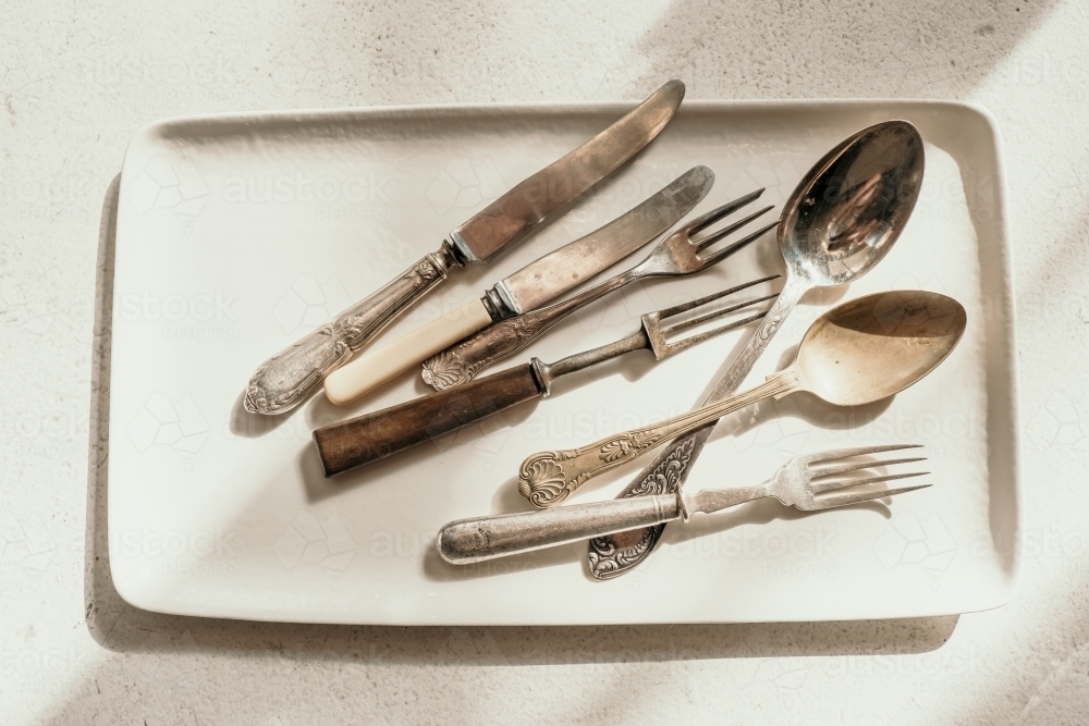 Decorative cutlery on a plate. - Australian Stock Image
