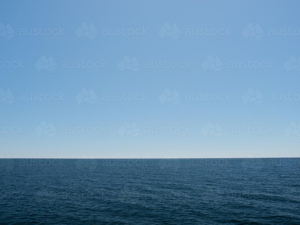 Deep blue ocean with pale blue sky - Australian Stock Image