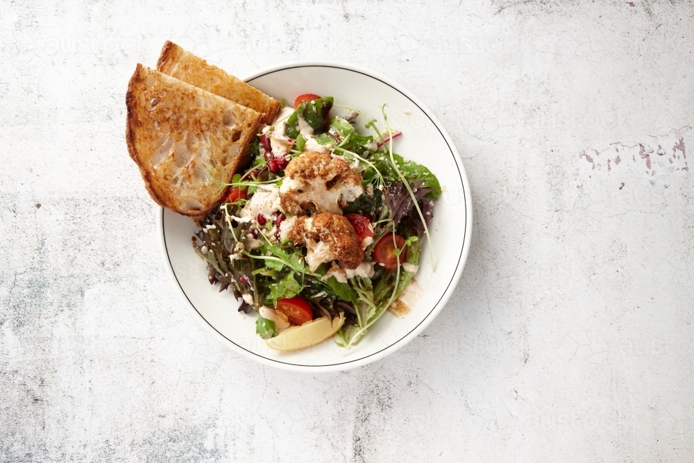 Delicious vegetarian cauliflower salad in bowl - Australian Stock Image