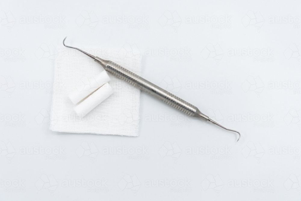 Dental tool hygiene scaler with cotton rolls and guaze - Australian Stock Image