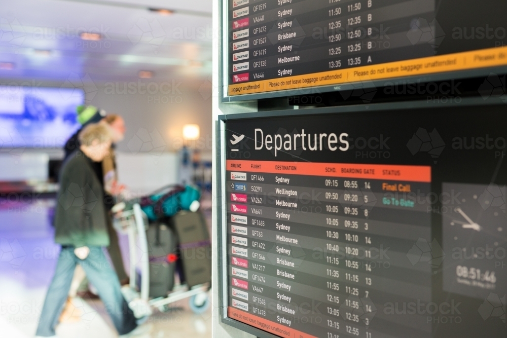 Departure sign showing flights at an airport - Australian Stock Image