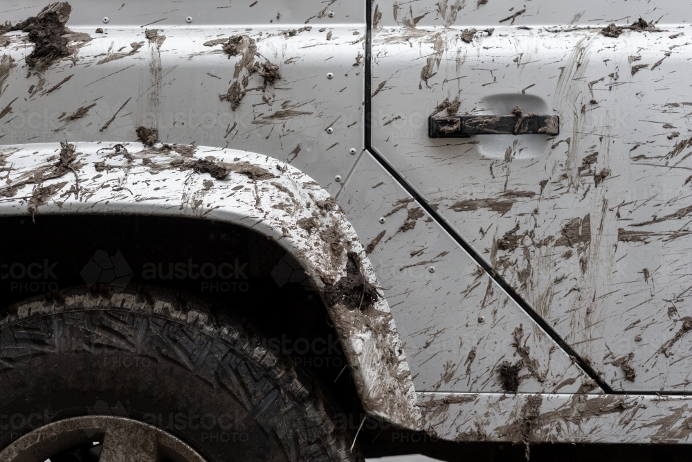 Detail of a four wheel drive vehicle splattered with mud - Australian Stock Image