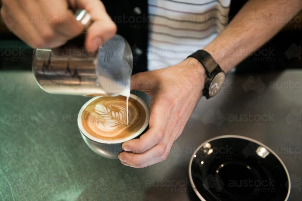 Detail of barista making coffee inside a cafe - Australian Stock Image