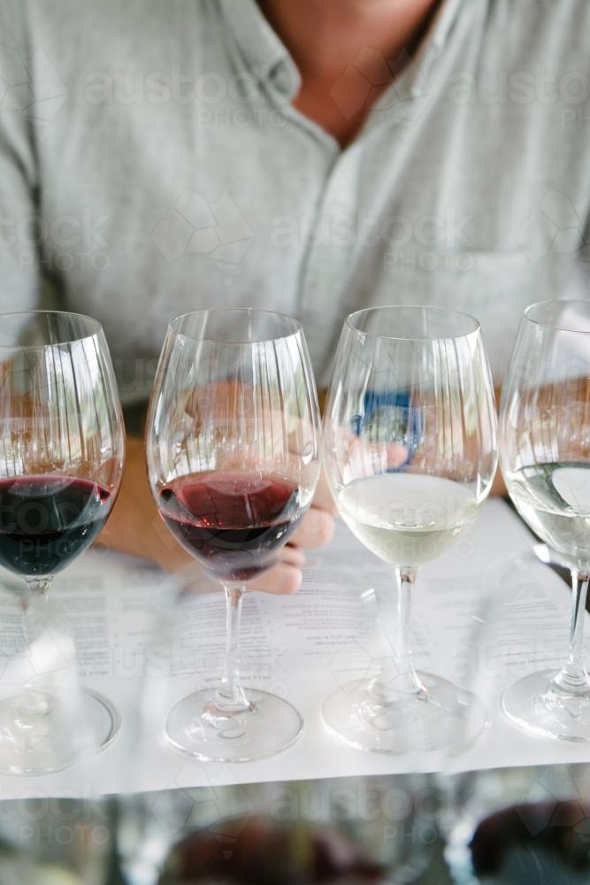detail of glasses at a wine tasting - Australian Stock Image