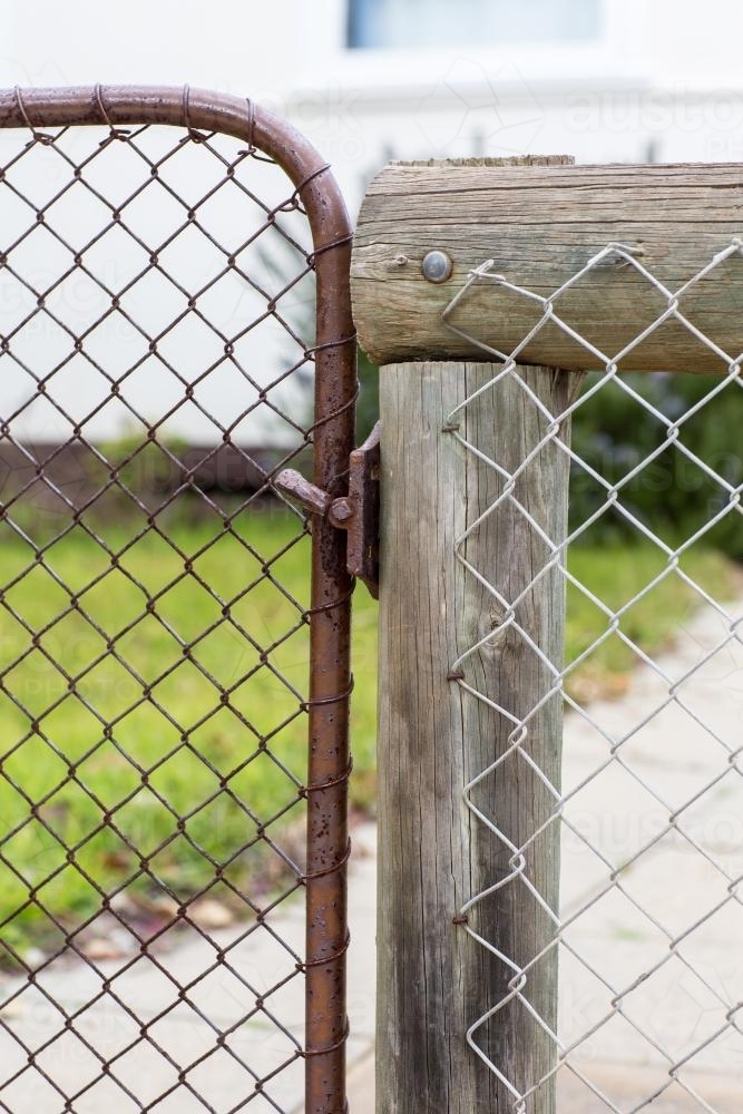 Detail of metal gate with chain-link fence - Australian Stock Image