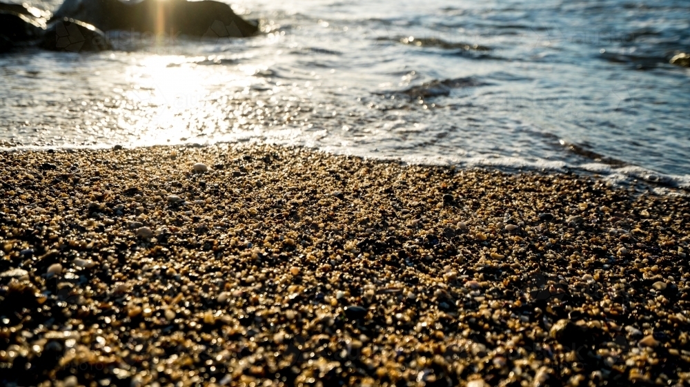 Detail of stones on pebbly ocean beach - Australian Stock Image
