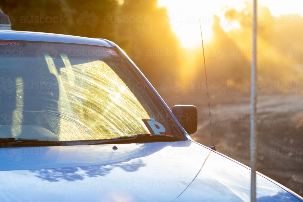detail of ute with P plate in evening light and sun flare - Australian Stock Image