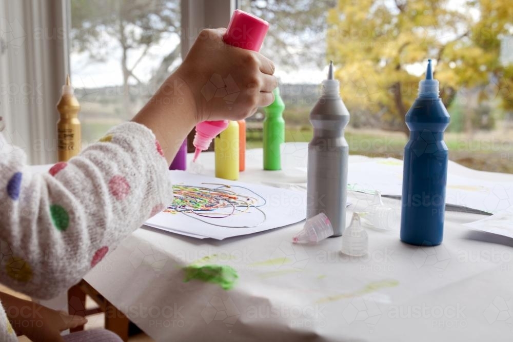 Detail of young girl with paints - Australian Stock Image