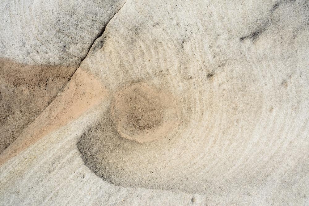 Detail shot of patterned rock in creams and oranges - Australian Stock Image