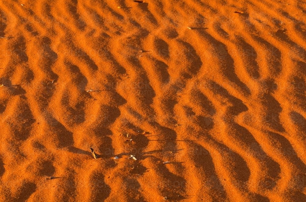 Detail shot of ripples in orange sand - Australian Stock Image