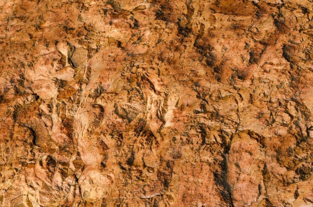 Detail shot of textured orange rock - Australian Stock Image