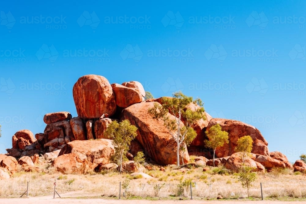 Devil's Marbles in bright sunlight in outback Northern territory - Australian Stock Image