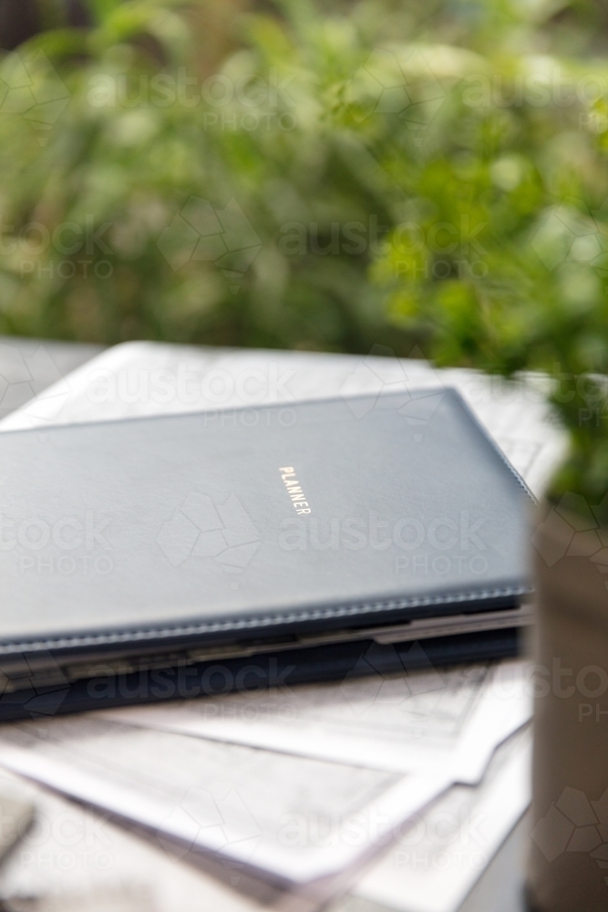 Diary on table outdoors - Australian Stock Image