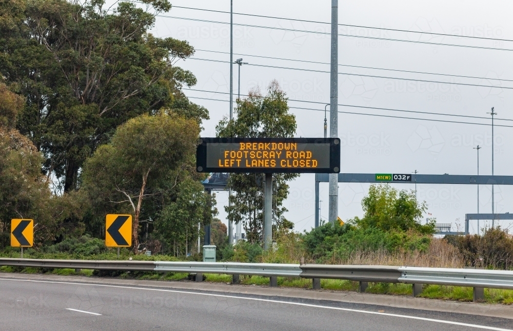 Digital roadside sign alerting of breakdown on footscray road with left lanes closed - Australian Stock Image