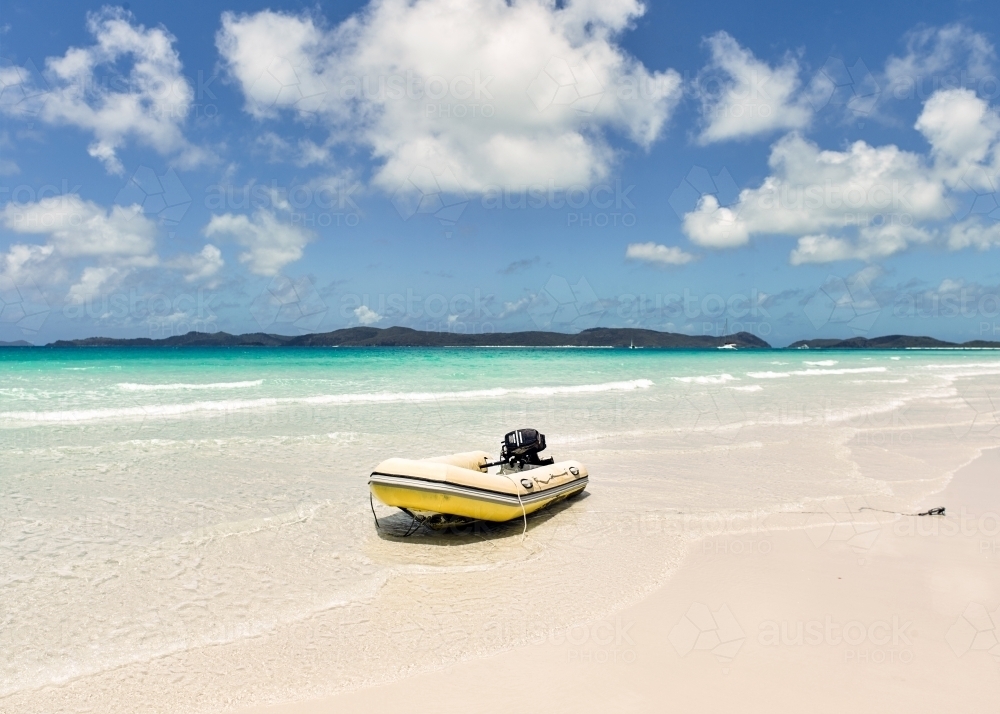Dinghy in the shallows of a tropical island - Australian Stock Image