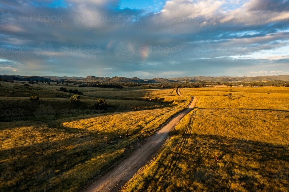 dirt road through granite belt landscape - Australian Stock Image