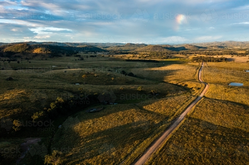 dirt road through granite belt landscape - Australian Stock Image