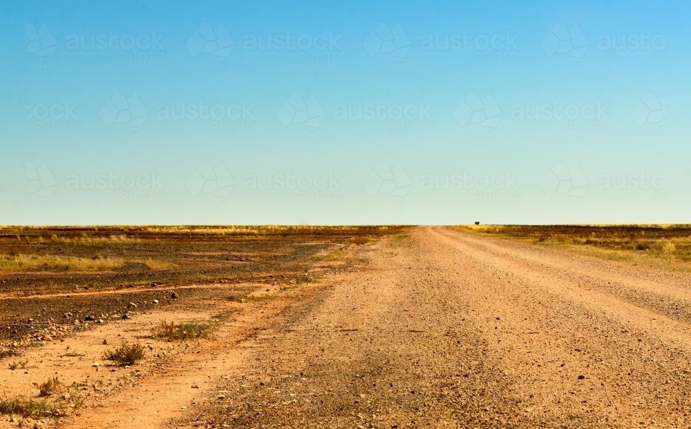 Dirt road through the Gibber Country to the Simpson Desert - Australian Stock Image