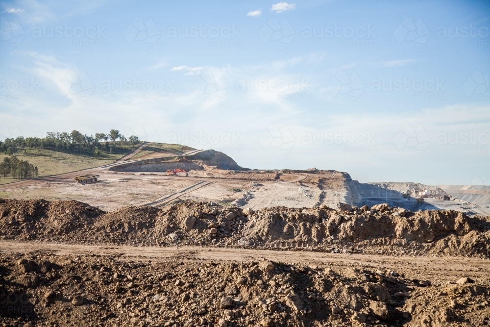 Dirt with caterpillar tracks beside open cut coal mine - Australian Stock Image