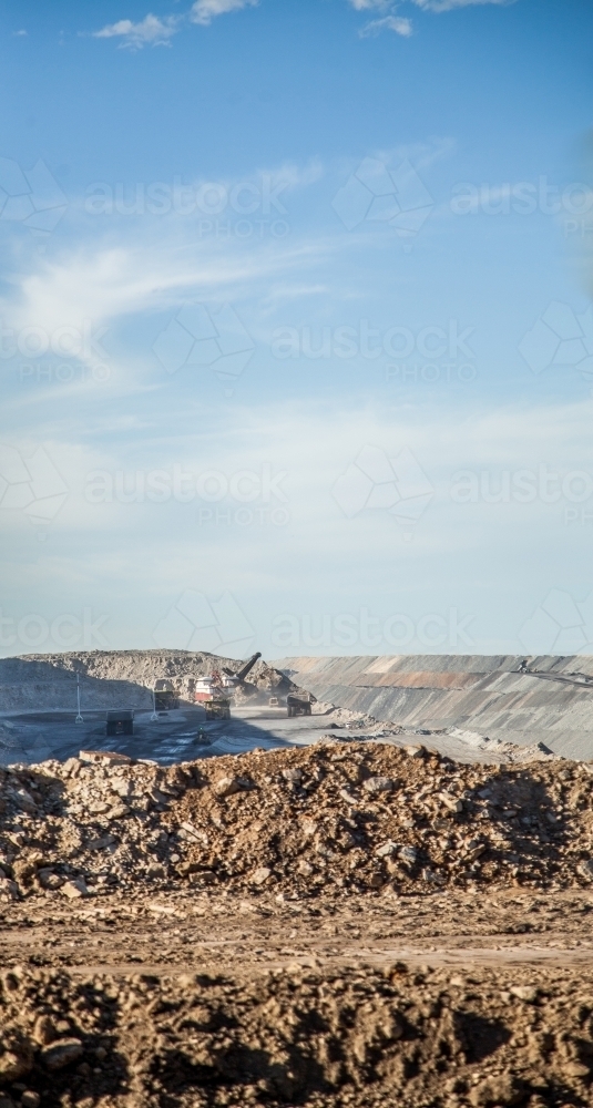 Dirt with caterpillar tracks beside open cut coal mine - Australian Stock Image
