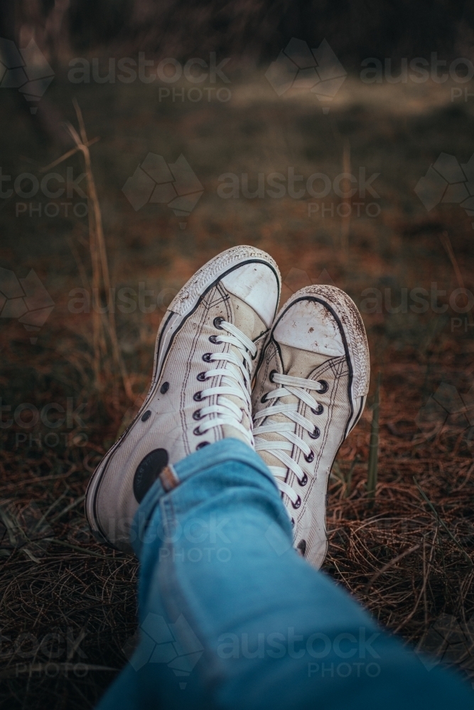 Dirty Shoes - Sitting in a bed of pine needles. - Australian Stock Image