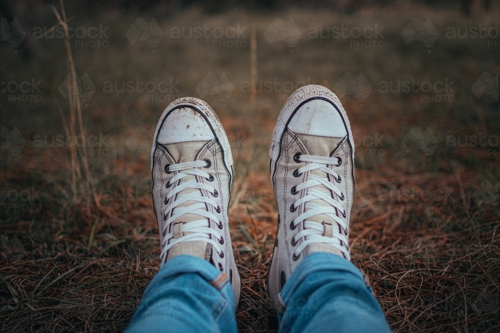Image of Dirty Shoes - Sitting in a bed of pine needles. - Austockphoto
