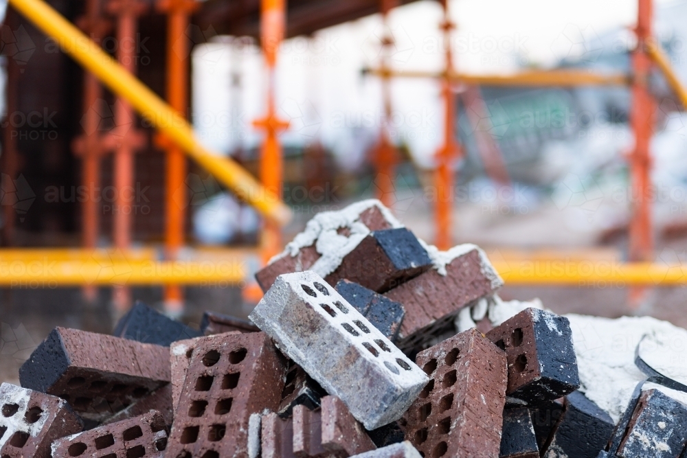 Discarded bricks in pile on construction site - Australian Stock Image