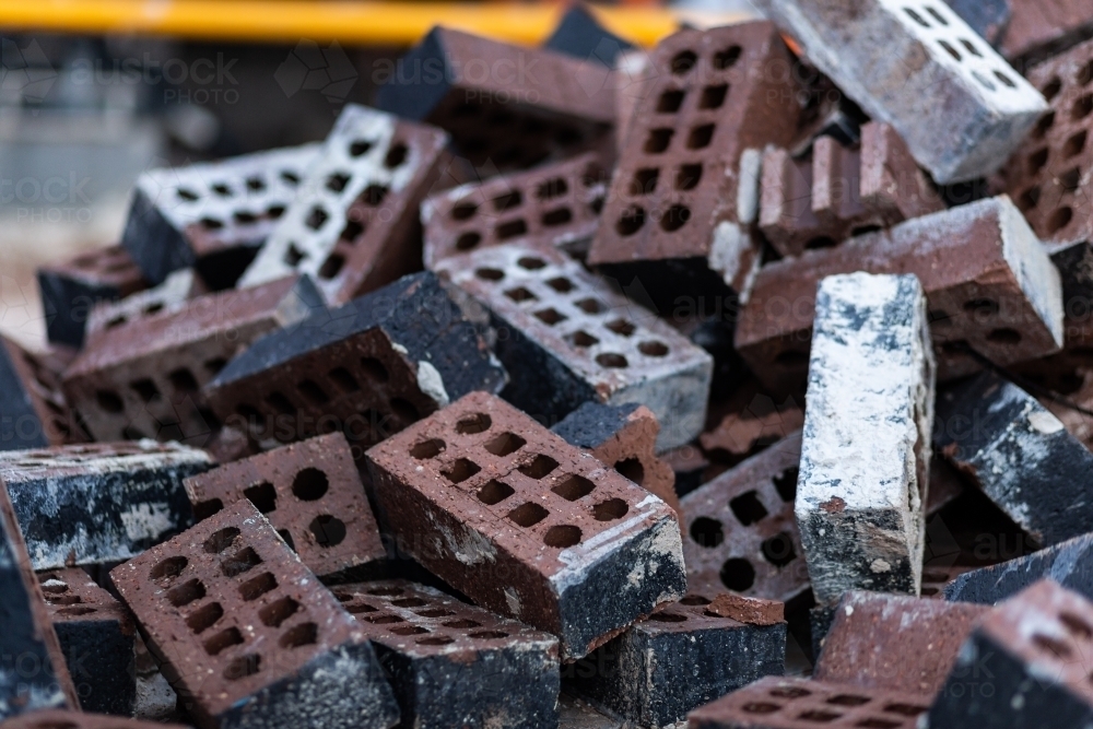 Image of Discarded bricks in pile on construction site - Austockphoto