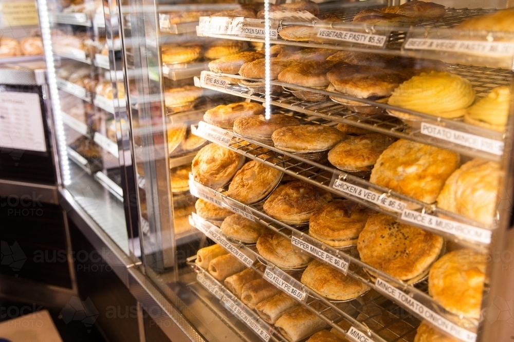 display cabinets filled with pies at a local bakery - Australian Stock Image