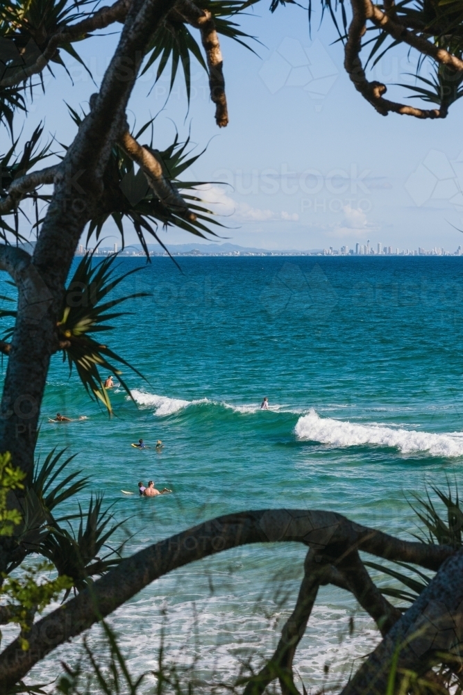 Distant view of Broadbeach with surfers in the water - Australian Stock Image